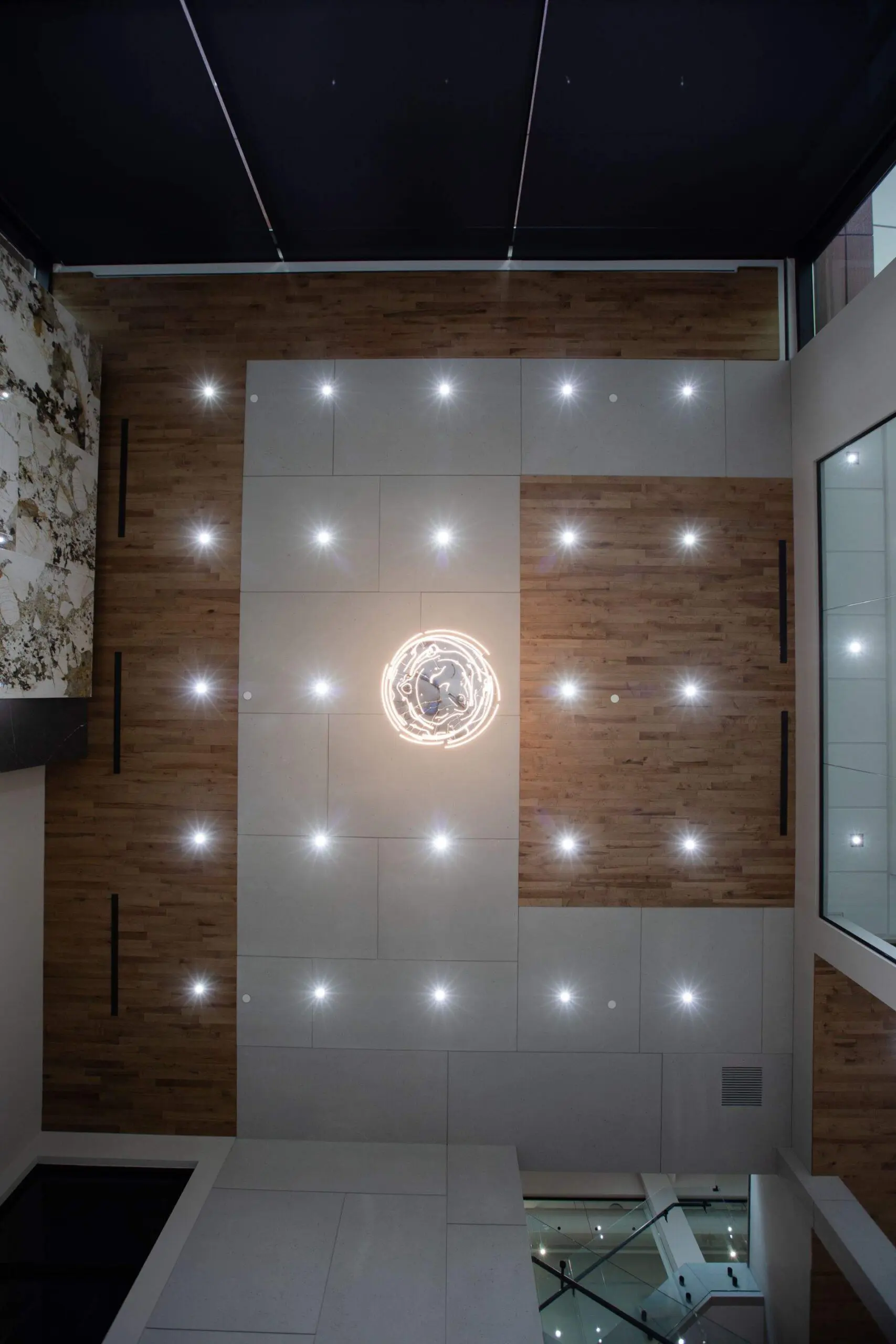 Modern industrial space with concrete cladding ceiling and feature lights. 