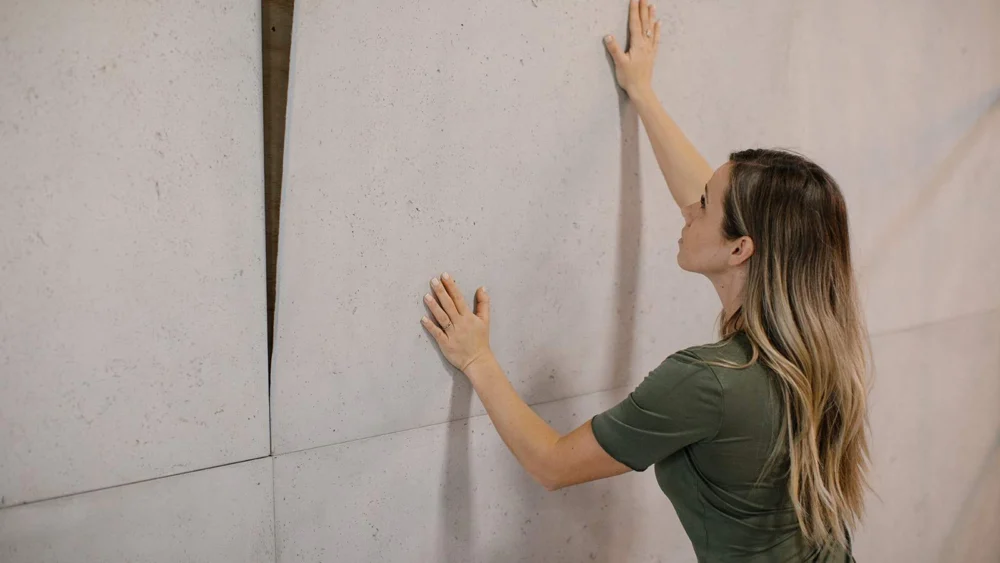 Contractor installng concrete cladding.