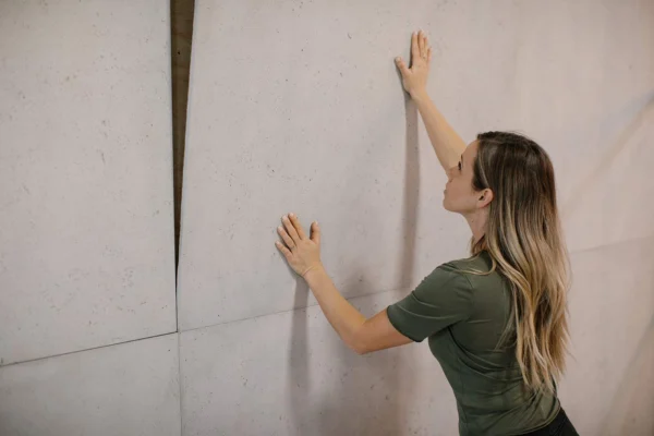 Contractor installng concrete cladding.